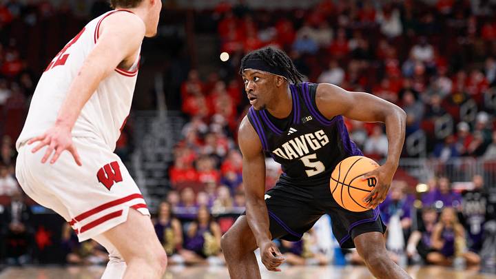 Mar 12, 2026; Chicago, IL, USA; Washington Huskies guard Zoom Diallo (5) controls the ball against Wisconsin Badgers forward Austin Rapp (22) during the first half at United Center. Mandatory Credit: Kamil Krzaczynski-Imagn Images Mar 12, 2026; Chicago, IL, USA; Washington Huskies guard Zoom Diallo (5) controls the ball against Wisconsin Badgers forward Austin Rapp (22) during the first half at United Center. Mandatory Credit: Kamil Krzaczynski-Imagn Images