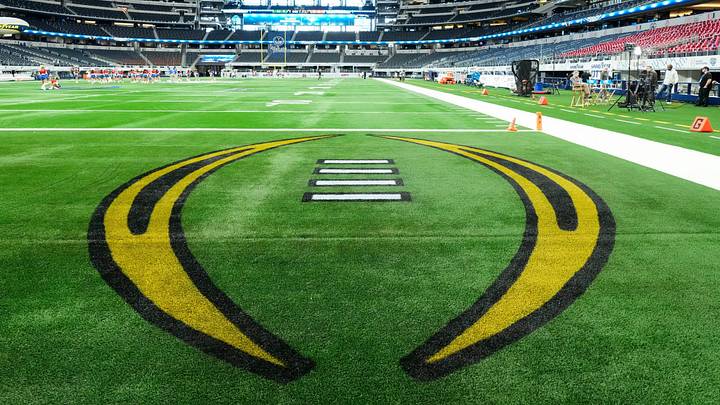 The College Football Playoff logo is painted in the endzone prior to the Cotton Bowl between the Ohio State Buckeyes and the Miami Hurricanes at AT&T Stadium in Arlington, Texas on Dec. 31, 2025.