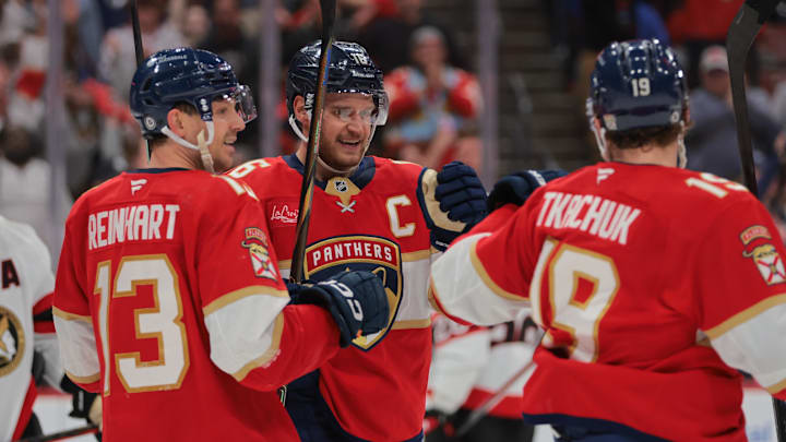 Feb 8, 2025; Sunrise, Florida, USA; Florida Panthers center Aleksander Barkov (16) celebrates with center Sam Reinhart (13) and left wing Matthew Tkachuk (19) after scoring against the Ottawa Senators during the second period at Amerant Bank Arena. Mandatory Credit: Sam Navarro-Imagn Images