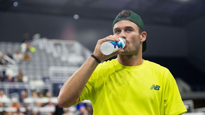 Tommy Paul hydrates before a match the 2025 Dallas Open.