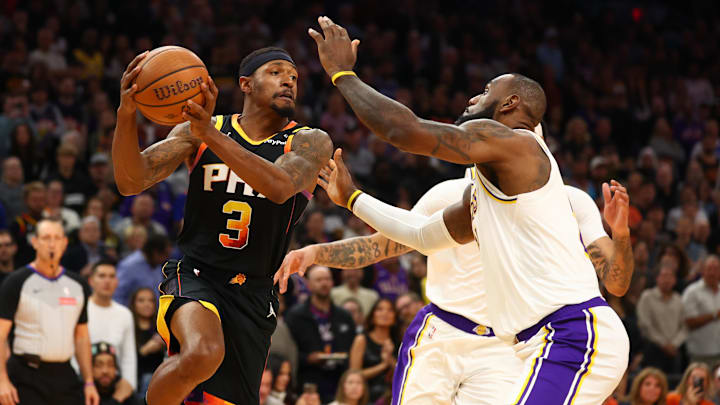 Nov 26, 2024; Phoenix, Arizona, USA; Los Angeles Lakers forward LeBron James (23) defends against Phoenix Suns guard Bradley Beal (3) during an NBA Cup game at Footprint Center. Mandatory Credit: Mark J. Rebilas-Imagn Images