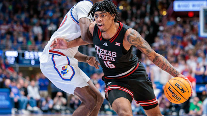 Mar 1, 2025; Lawrence, Kansas, USA; Texas Tech Red Raiders forward JT Toppin (15) drives to the basket during the first half against the Kansas Jayhawks at Allen Fieldhouse. Mandatory Credit: William Purnell-Imagn Images