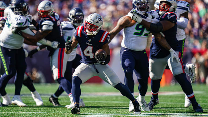 Sep 15, 2024; Foxborough, Massachusetts, USA; New England Patriots running back Antonio Gibson (4) runs the ball against the Seattle Seahawks in the second half at Gillette Stadium. Mandatory Credit: David Butler II-Imagn Images