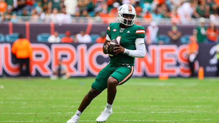Nov 2, 2024; Miami Gardens, Florida, USA; Miami Hurricanes quarterback Cam Ward (1) looks for a passing option against the Duke Blue Devils during the first quarter at Hard Rock Stadium. Mandatory Credit: Sam Navarro-Imagn Images Nov 2, 2024; Miami Gardens, Florida, USA; Miami Hurricanes quarterback Cam Ward (1) looks for a passing option against the Duke Blue Devils during the first quarter at Hard Rock Stadium. Mandatory Credit: Sam Navarro-Imagn Images