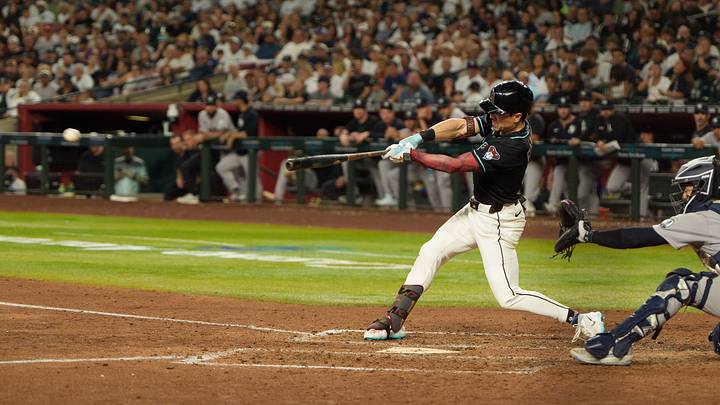 Sep 18, 2026; Phoenix, Arizona, USA;  Arizona Diamondbacks outfielder Corbin Carroll (7) doubles in the seventh inning of a game against the New York Yankees at Chase Field.  Mandatory Credit: Allan Henry-Imagn Images