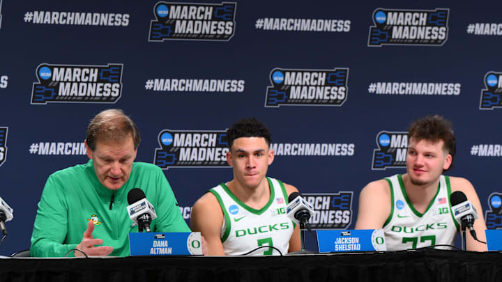 Mar 21, 2025; Seattle, WA, USA; Oregon Ducks head coach Dana Altman speaks at a press conference with guard Jackson Shelstad (3) and center Nate Bittle (32) after defeating the Liberty Flames in the first round of the NCAA Tournament at Climate Pledge Arena. Mandatory Credit: Steven Bisig-Imagn Images