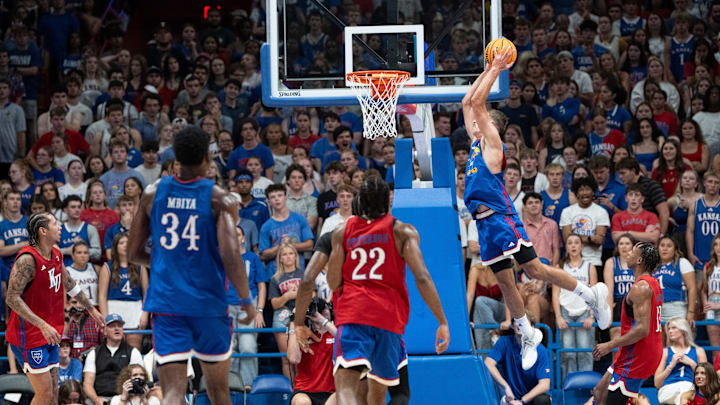 Kansas men's basketball's Jayden Dawson (1) dunks the ball during Late Night in the Phog, Friday, Oct. 17, 2025 at Allen Fieldhouse .