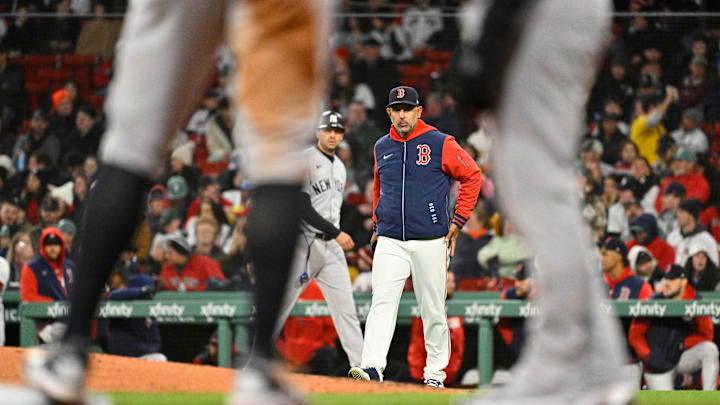 Apr 22, 2026; Boston, Massachusetts, USA; Boston Red Sox manager Alex Cora (13) walks to the pitcher's mound during fifth inning against the New York Yankees at Fenway Park. Mandatory Credit: Eric Canha-Imagn Images