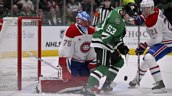 Jan 16, 2025; Dallas, Texas, USA; Dallas Stars center Wyatt Johnston (53) attempts to redirect the puck past Montreal Canadiens goaltender Jakub Dobes (75) during the second period at the American Airlines Center. Mandatory Credit: Jerome Miron-Imagn Images