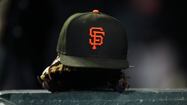 General view of a San Francisco Giants cap and glove during the ninth inning against the Colorado Rockies at Coors Field in Denver in September 2023.