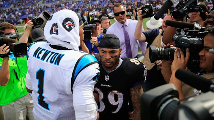 BALTIMORE, MD - SEPTEMBER 28: Wide receiver Steve Smith #89 of the Baltimore Ravens and quarterback Cam Newton #1 of the Carolina Panthers meet at mid field after the Ravens defeated the Panthers 38-10 at M&T Bank Stadium on September 28, 2014 in Baltimore, Maryland. 