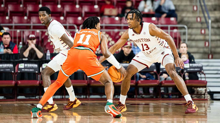 Boston College guard Donald Hand Jr. defends a Miami ball handler during play last night. 