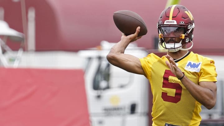 Jun 5, 2024; Ashburn, VA, USA; Washington Commanders quarterback Jayden Daniels (5) passes the ball during OTA workouts at Commanders Park. Mandatory Credit: Geoff Burke-USA TODAY Sports Jun 5, 2024; Ashburn, VA, USA; Washington Commanders quarterback Jayden Daniels (5) passes the ball during OTA workouts at Commanders Park. Mandatory Credit: Geoff Burke-USA TODAY Sports
