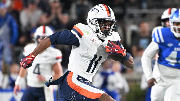 Nov 15, 2025; Durham, North Carolina, USA; Virginia Cavaliers wide receiver Trell Harris (11) runs the ball during the third quarter against the Duke Blue Devils at Wallace Wade Stadium. Mandatory Credit: Zachary Taft-Imagn Images Nov 15, 2025; Durham, North Carolina, USA; Virginia Cavaliers wide receiver Trell Harris (11) runs the ball during the third quarter against the Duke Blue Devils at Wallace Wade Stadium. Mandatory Credit: Zachary Taft-Imagn Images