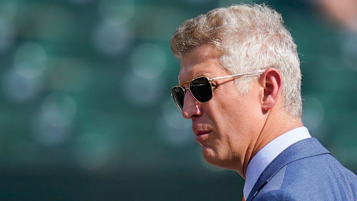 Jul 27, 2022; Baltimore, Maryland, USA; Baltimore Orioles general manager Mike Elias stands oil the field before the game against the Tampa Bay Rays  at Oriole Park at Camden Yards. 