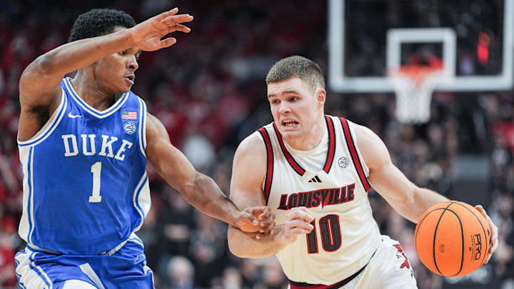 Duke Blue Devils guard Caleb Foster (1) guards Louisville Cardinals guard Isaac McKneely (10) during ACC play January 6, 2026.