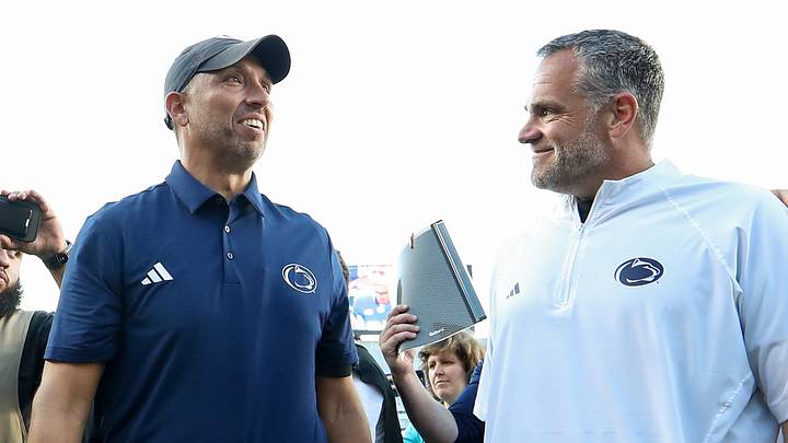 Penn State Nittany Lions athletic director Pat Kraft (right) speaks with head coach Matt Campbell (left) following the game against the Marshall Thundering Herd at Beaver Stadium. 