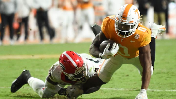 Tennessee running back Jaylen Wright (0) is stopped by Georgia defensive back Tykee Smith (23)
