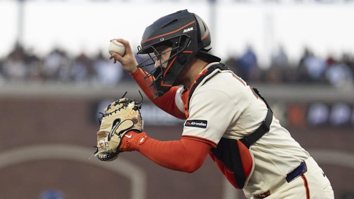 Apr 22, 2026; San Francisco, California, USA; San Francisco Giants catcher Patrick Bailey (14) chases with the ball during the fifth inning against the Los Angeles Dodgers at Oracle Park. Mandatory Credit: Stan Szeto-Imagn Images