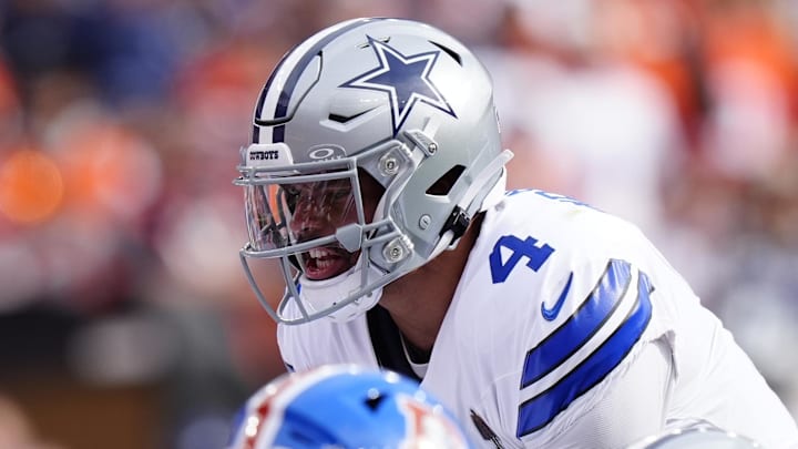 Dallas Cowboys quarterback Dak Prescott (4) calls a play in the first quarter against the Denver Broncos at Empower Field at Mile High.