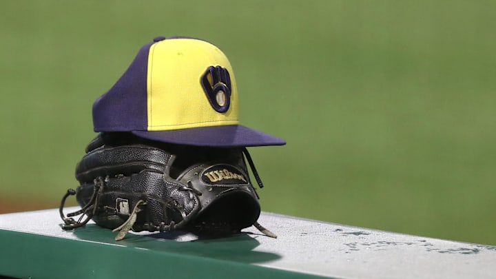 Jul 27, 2020; Pittsburgh, Pennsylvania, USA; A Milwaukee Brewers hat and glove on the dugout rail against the Pittsburgh Pirates during the tenth inning at PNC Park.Milwaukee won 6-5 in eleven innings. Mandatory Credit: Charles LeClaire-Imagn Images Jul 27, 2020; Pittsburgh, Pennsylvania, USA; A Milwaukee Brewers hat and glove on the dugout rail against the Pittsburgh Pirates during the tenth inning at PNC Park.Milwaukee won 6-5 in eleven innings. Mandatory Credit: Charles LeClaire-Imagn Images