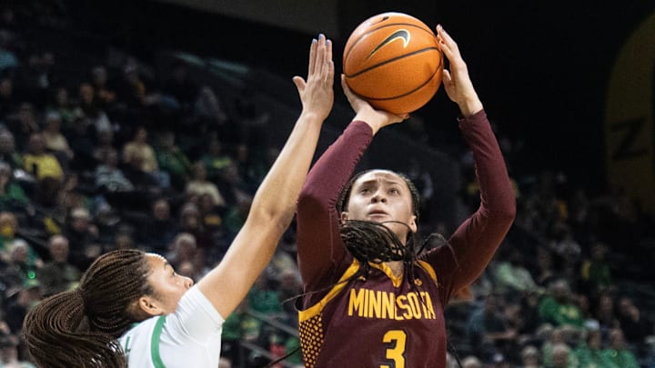 Minnesota’s Amaya Battle, right, shoots around Oregon’s Sofia Bell during the first half at Matthew Knight Arena in Eugene Jan. 21, 2026.