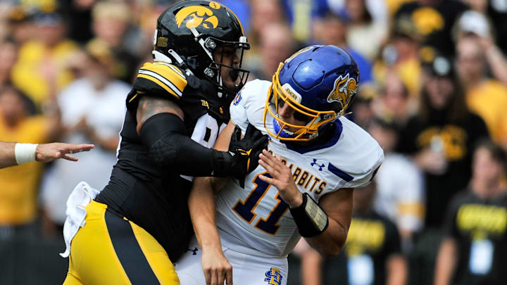 Sep 3, 2022; Iowa City, Iowa, USA; Iowa Hawkeyes defensive lineman Noah Shannon (99) shoves South Dakota State Jackrabbits quarterback Mark Gronowski (11) during the first quarter at Kinnick Stadium. Mandatory Credit: Jeffrey Becker-Imagn Images
