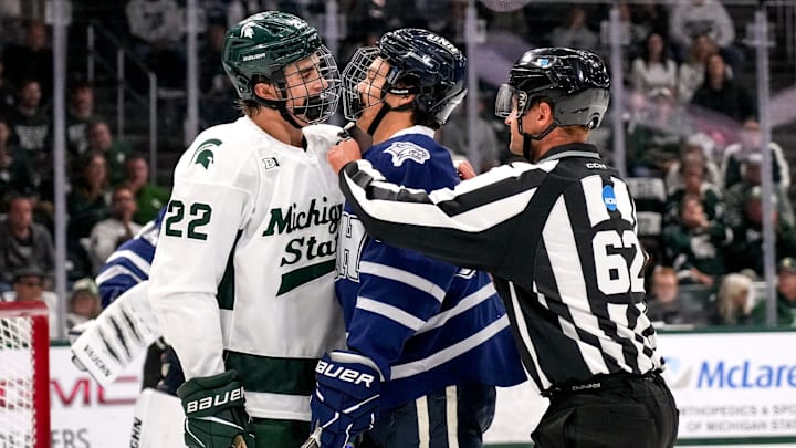 Michigan State's Porter Martone, left, has words with New Hampshire's Josh Player during the first period on Thursday, Oct. 9, 2025, at Munn Ice Arena in East Lansing.