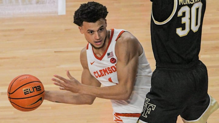 Clemson junior guard Chase Hunter (1) passes around Wake Forest guard Damari Monsanto (30) during the second half at Littlejohn Coliseum Friday, December 2, 2022.

Clemson Basketball Vs Wake Forest University Acc