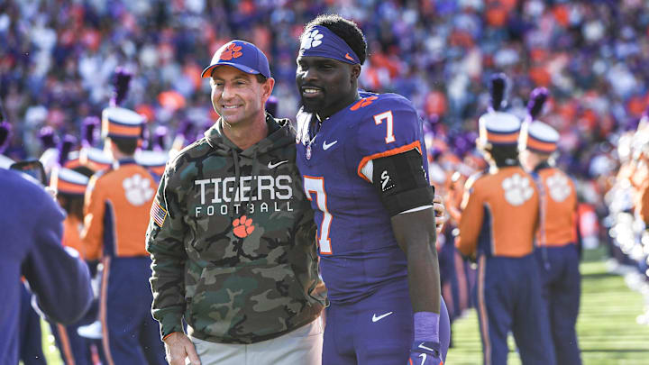 Clemson Tigers head coach Dabo Swinney stands with running back Phil Mafah on Senior Day before a game against The Citadel.