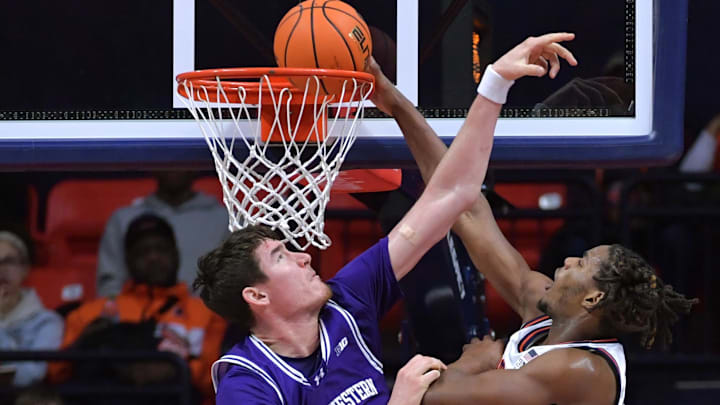 Jan 26, 2025; Champaign, Illinois, USA; Illinois Fighting Illini forward Morez Johnson Jr. (21) dunks the ball over Northwestern Wildcats center Keenan Fitzmorris (5) during the second half at State Farm Center. Mandatory Credit: Ron Johnson-Imagn Images Jan 26, 2025; Champaign, Illinois, USA; Illinois Fighting Illini forward Morez Johnson Jr. (21) dunks the ball over Northwestern Wildcats center Keenan Fitzmorris (5) during the second half at State Farm Center. Mandatory Credit: Ron Johnson-Imagn Images