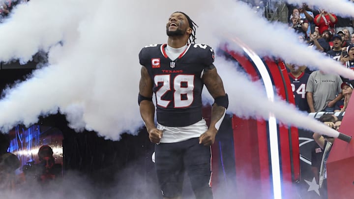 Dec 15, 2024; Houston Texans running back Joe Mixon (28) runs onto the field before the game against the Miami Dolphins at NRG Stadium. Mandatory Credit: Troy Taormina-Imagn Images