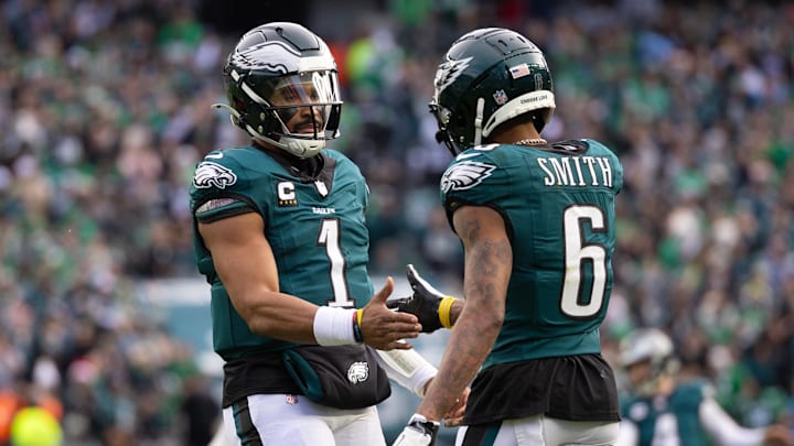 Dec 8, 2024; Philadelphia, Pennsylvania, USA; Philadelphia Eagles wide receiver DeVonta Smith (6) and quarterback Jalen Hurts (1) celebrate their touchdown connection against the Carolina Panthers during the second quarter at Lincoln Financial Field. Mandatory Credit: Bill Streicher-Imagn Images Dec 8, 2024; Philadelphia, Pennsylvania, USA; Philadelphia Eagles wide receiver DeVonta Smith (6) and quarterback Jalen Hurts (1) celebrate their touchdown connection against the Carolina Panthers during the second quarter at Lincoln Financial Field. Mandatory Credit: Bill Streicher-Imagn Images