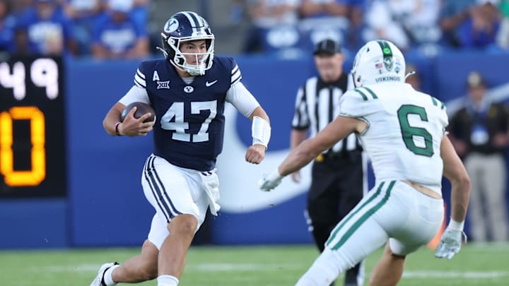 Aug 30, 2025; Provo, Utah, USA; Brigham Young Cougars quarterback Bear Bachmeier (47) runs against Portland State Vikings linebacker Jaxton Helmstetler (6) during the second quarter at LaVell Edwards Stadium. Mandatory Credit: Rob Gray-Imagn Images