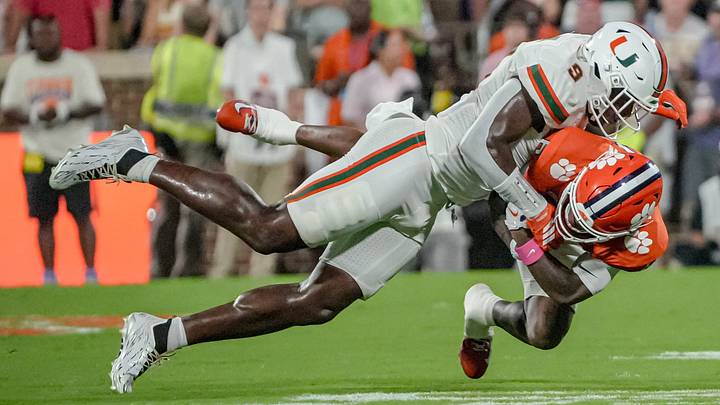Miami Hurricanes linebacker Chase Smith (9) tackles Clemson receiver Tyler Brown (6) during the first quarter at Memorial Stadium Saturday, October 3, 2026.
