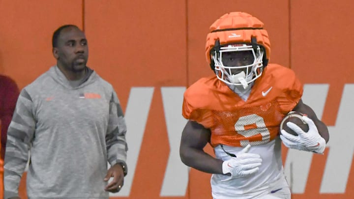 Clemson running back Gideon Davidson (9) catches a kickoff near offensive run game coach C.J. Spiller during the football practice at the Allen N. Reeves Football Complex at Clemson University in Clemson, S.C. Monday, March 3, 2025. Clemson running back Gideon Davidson (9) catches a kickoff near offensive run game coach C.J. Spiller during the football practice at the Allen N. Reeves Football Complex at Clemson University in Clemson, S.C. Monday, March 3, 2025.
