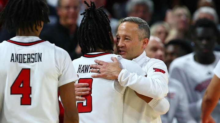 Mar 22, 2025; Wichita, KS, USA; Texas Tech Red Raiders head coach Grant McCasland hugs guard Elijah Hawkins (3) after their win against the Drake Bulldogs at Intrust Bank Arena. Mandatory Credit: Nick Tre. Smith-Imagn Imagesgggg