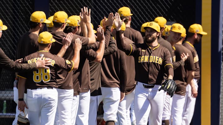 Mar 11, 2025; Peoria, Arizona, USA; San Diego Padres pitcher Dylan Cease greets teammates against the Chicago White Sox during a spring training game at Peoria Sports Complex. Mandatory Credit: Mark J. Rebilas-Imagn Images Mar 11, 2025; Peoria, Arizona, USA; San Diego Padres pitcher Dylan Cease greets teammates against the Chicago White Sox during a spring training game at Peoria Sports Complex. Mandatory Credit: Mark J. Rebilas-Imagn Images