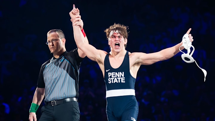 A bloodied Tyler Kasak of Penn State celebrates after defeating Iowa's Jacori Teemer 5-2 in the 157-pound bout of their Big Ten wrestling match at the Bryce Jordan Center. A bloodied Tyler Kasak of Penn State celebrates after defeating Iowa's Jacori Teemer 5-2 in the 157-pound bout of their Big Ten wrestling match at the Bryce Jordan Center.