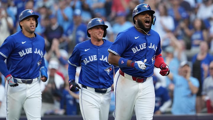 Oct 5, 2025; Toronto, Ontario, CAN; Toronto Blue Jays first baseman Vladimir Guerrero Jr. (27) celebrates with teammates after hitting a grand slam in the fourth inning against the New York Yankees during game two of the ALDS round for the 2025 MLB playoffs at Rogers Centre Oct 5, 2025; Toronto, Ontario, CAN; Toronto Blue Jays first baseman Vladimir Guerrero Jr. (27) celebrates with teammates after hitting a grand slam in the fourth inning against the New York Yankees during game two of the ALDS round for the 2025 MLB playoffs at Rogers Centre