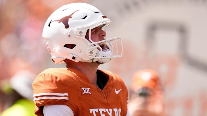 Texas Longhorns quarterback Quinn Ewers celebrates his touchdown in the first quarter against the