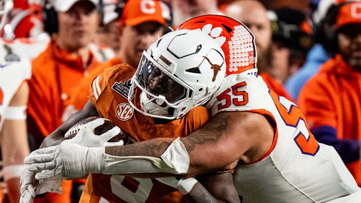 Texas Longhorns running back Jerrick Gibson (9) is pushed out of bounds by Clemson Tigers defensive tackle Payton Page (55) in the fourth quarter in the first round of the College Football Playoffs at Darrell K Royal Texas Memorial Stadium.
