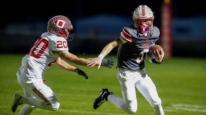 Oostburg’s Parker Levin (20) works to pull down Manitowoc Lutheran’s Ethan Brooks (8, right), Friday, September 25, 2026, in Manitowoc, Wis. Oostburg’s Parker Levin (20) works to pull down Manitowoc Lutheran’s Ethan Brooks (8, right), Friday, September 25, 2026, in Manitowoc, Wis.