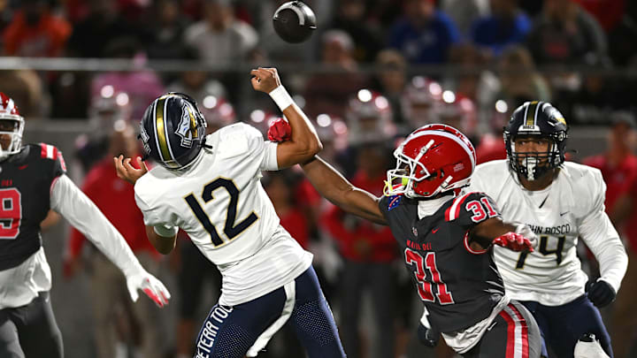 Mater Dei 4-star linebacker Nasir Wyatt with a big hit on St. John Bosco freshman QB Koa Malau’ulu, during a surprising 59-14 lopsided victory over St. John Bosco at Santa Ana Stadium on Oct. 25. The teams rematch Friday for the CIF Southern Section Division 1 championship, the seventh time they've met since 2016