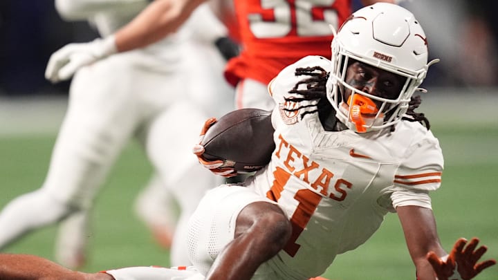 Dec 7, 2024; Atlanta, GA, USA; Texas Longhorns wide receiver Silas Bolden (11) makes a catch agaistn Georgia Bulldogs linebacker Jalon Walker (11) during the first half in the 2024 SEC Championship game at Mercedes-Benz Stadium. Mandatory Credit: Dale Zanine-Imagn Images