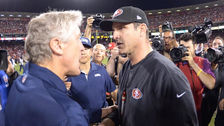 Oct 18, 2012; San Francisco, CA, USA; Seattle Seahawks coach Pete Carroll (left) with San Francisco 49ers coach Jim Harbaugh.