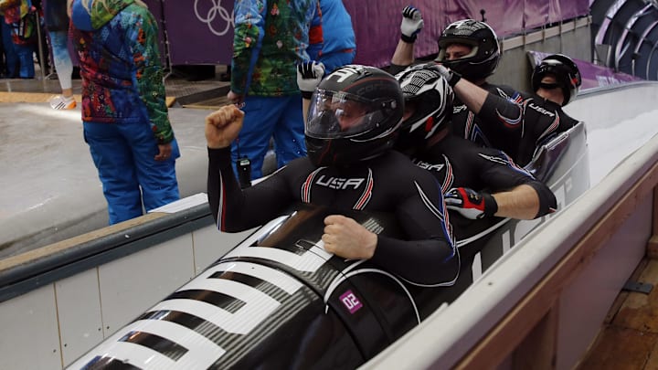 Feb 23, 2014; Krasnaya Polyana, RUSSIA; (From left to right) USA-1 piloted by Steven Holcomb with Curtis Tomasevicz, and Steven Langton, and Christopher Fogt react after heat four of men's four-man bobsleigh during the Sochi 2014 Olympic Winter Games at Sanki Sliding Center. USA-1 won bronze.