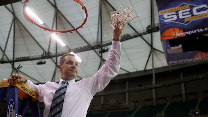 Mar 11, 2007; Atlanta, GA, USA; Florida Gators head coach Billy Donovan cuts down the net after the Gators defeated the Arkansas Razorbacks 77-56 to win the SEC Tournament championship game at the Georgia Dome in Atlanta, GA. Mandatory Credit: Jason Parkhurst-Imagn Images Copyright © 2007 Jason Parkhurst