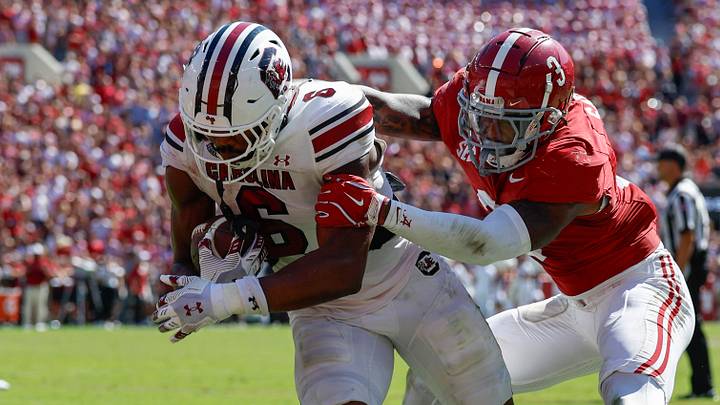Oct 12, 2024; Tuscaloosa, Alabama, USA; South Carolina Gamecocks tight end Joshua Simon (6) is tackled by Alabama Crimson Tide defensive back Keon Sabb (3) during the second half at Bryant-Denny Stadium. Mandatory Credit: Butch Dill-Imagn Images Oct 12, 2024; Tuscaloosa, Alabama, USA; South Carolina Gamecocks tight end Joshua Simon (6) is tackled by Alabama Crimson Tide defensive back Keon Sabb (3) during the second half at Bryant-Denny Stadium. Mandatory Credit: Butch Dill-Imagn Images