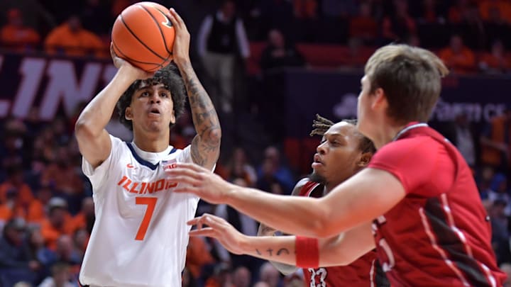 Nov 8, 2024; Champaign, Illinois, USA;  Illinois Fighting Illini forward Will Riley (7) shoots the ball over SIU Edwardsville Cougars forward Jo Valrie (33) during the first half at State Farm Center. Mandatory Credit: Ron Johnson-Imagn Images